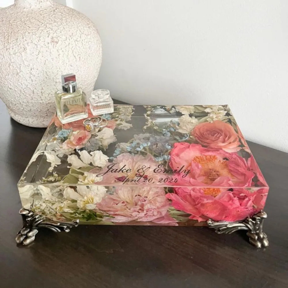 Resin Floral Preservation Vanity Tray with brass claw feet holding bridal jewelry alongside preserved wedding flowers.