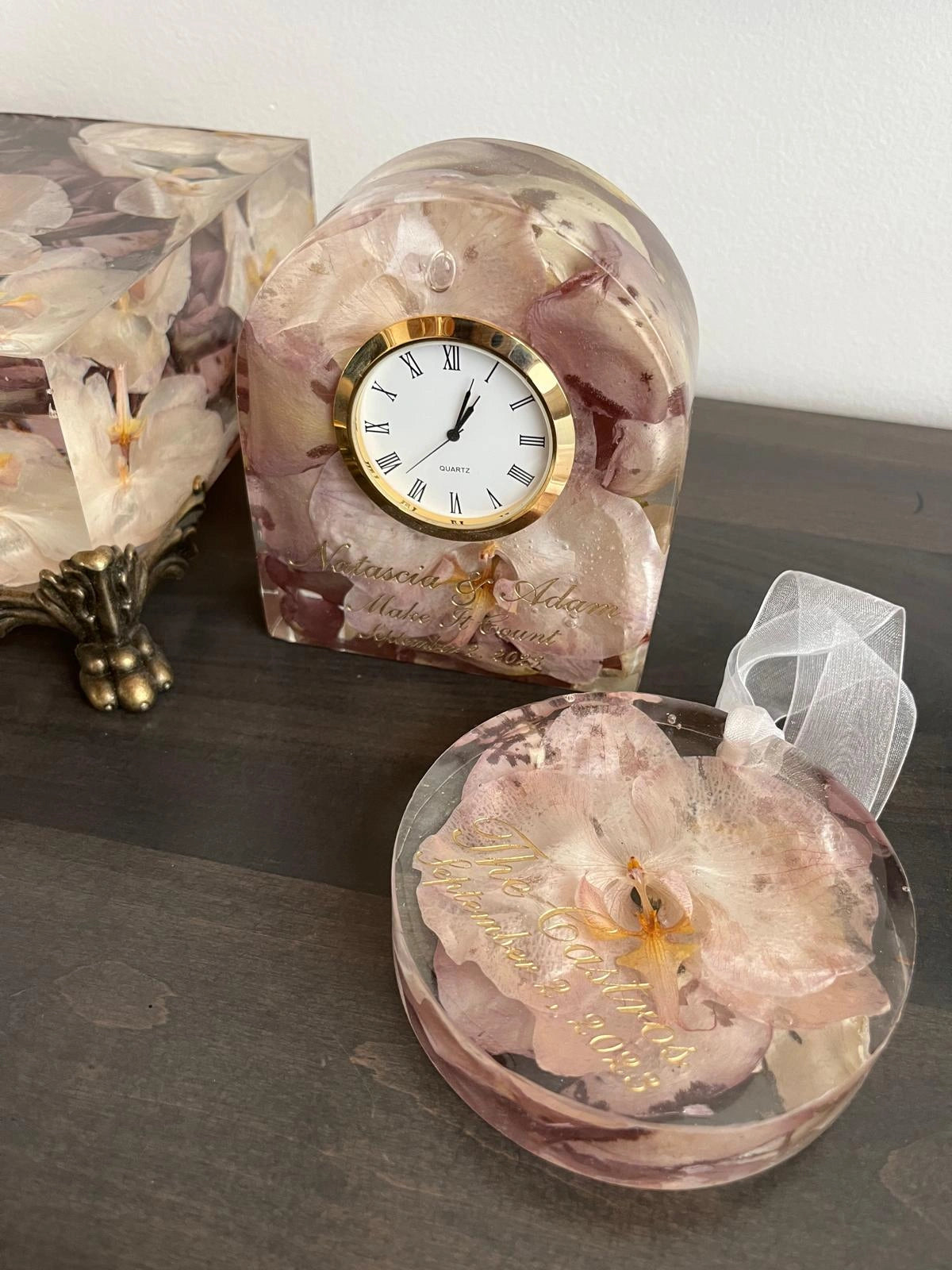 Resin Floral Preservation Ornament hanging with delicate preserved wedding bouquet petals inside.