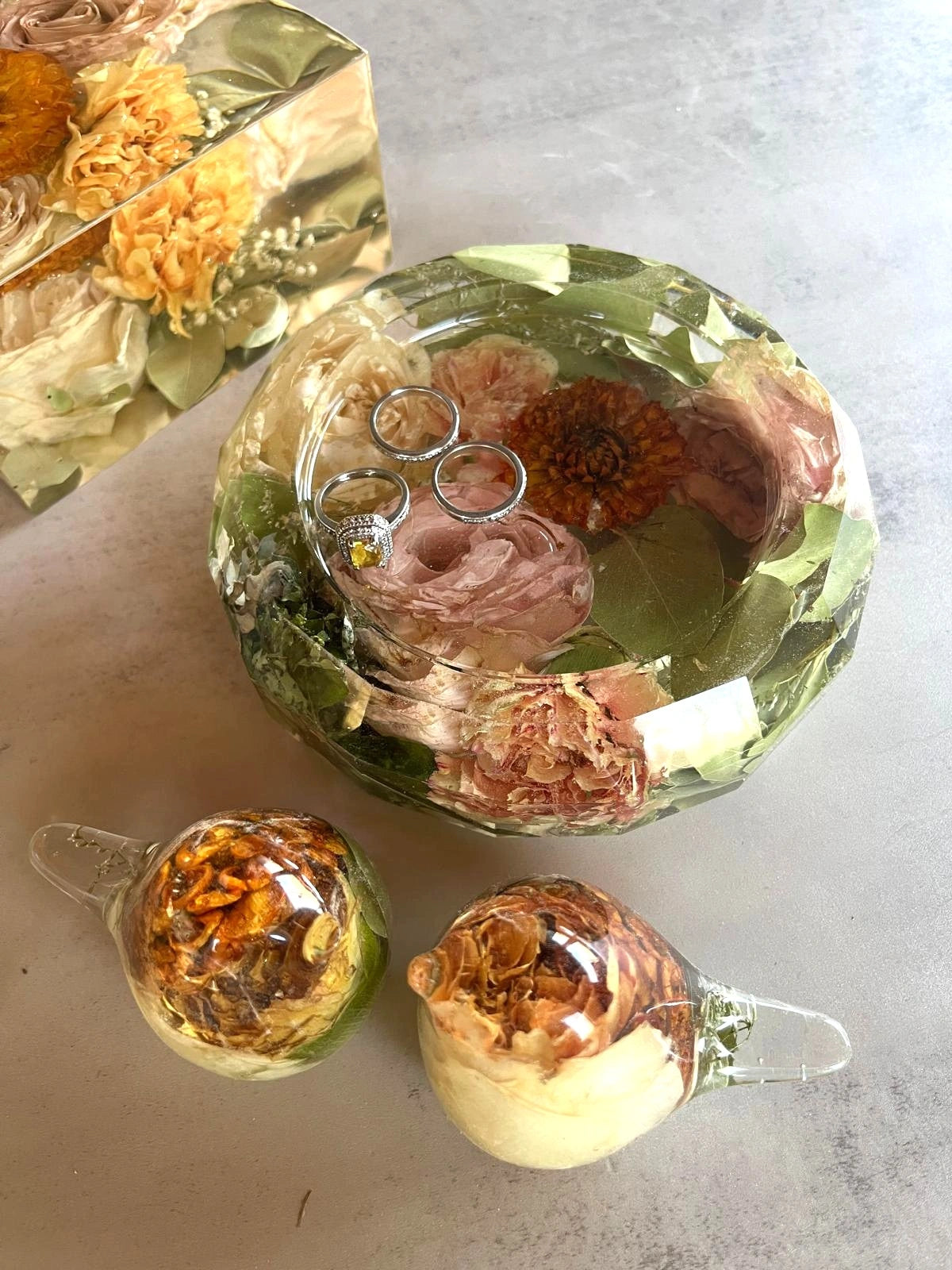 Resin Floral Preservation Trinket Dish holding small jewelry items with custom wedding bouquet fragments.