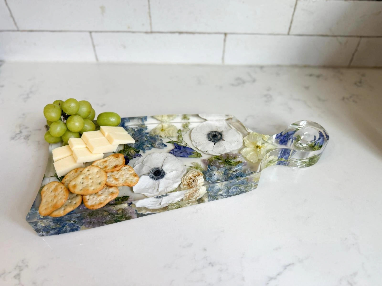 Resin Floral Preservation Charcuterie Board displaying wedding flowers in a functional serving tray.