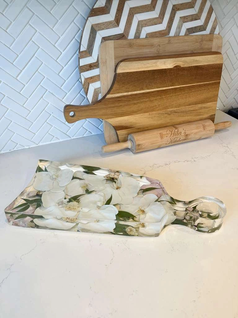 Resin Floral Preservation Charcuterie Board displaying wedding flowers in a functional serving tray.