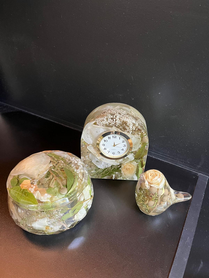 Resin Floral Preservation Jewelry Box storing wedding rings and mementos among preserved bouquet petals.