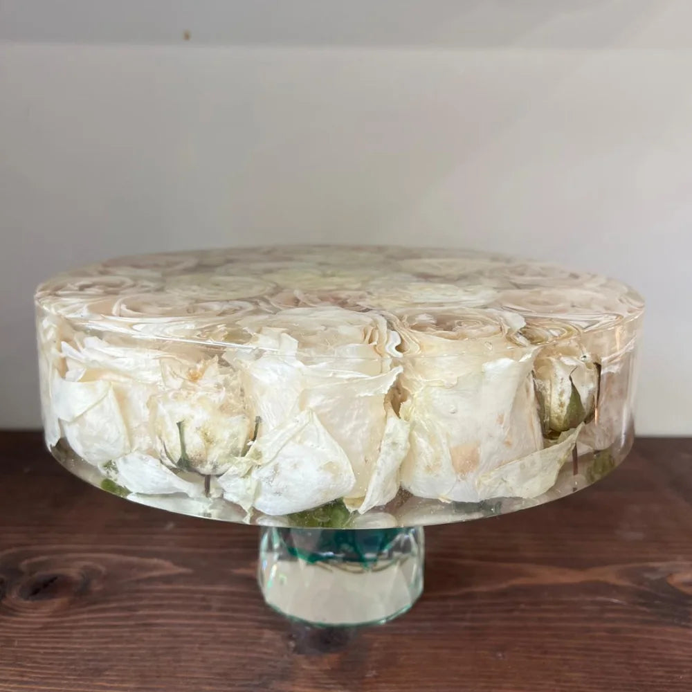 Resin Floral Preservation Cake Stand with glass dome displaying a custom preserved wedding bouquet centerpiece.