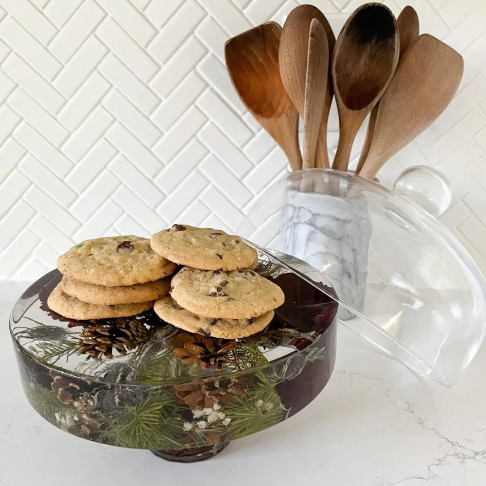 Resin Floral Preservation Cake Stand with glass dome displaying a custom preserved wedding bouquet centerpiece.