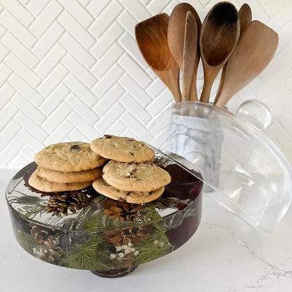 Resin Floral Preservation Cake Stand with glass dome displaying a custom preserved wedding bouquet centerpiece.