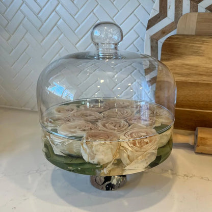 Resin Floral Preservation Cake Stand with glass dome displaying a custom preserved wedding bouquet centerpiece.