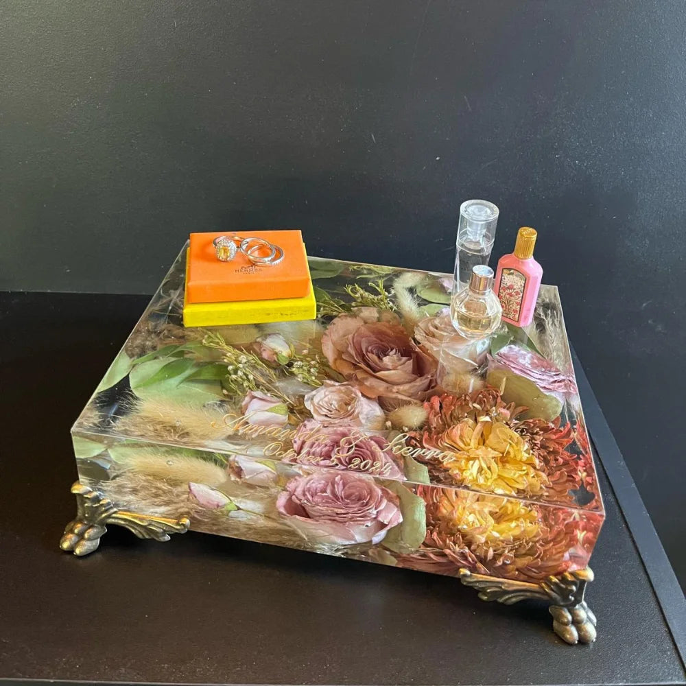 Resin Floral Preservation Vanity Tray with brass claw feet holding bridal jewelry alongside preserved wedding flowers.