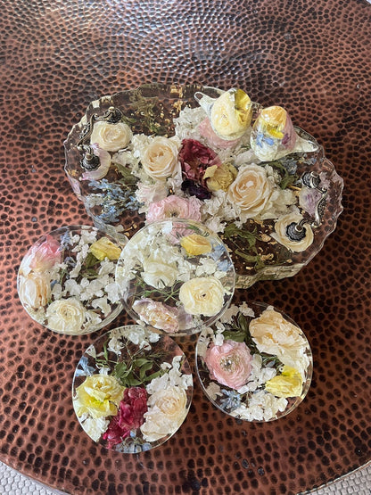 Set of Resin Floral Preservation Coasters protecting a table surface with custom wedding flowers embedded.