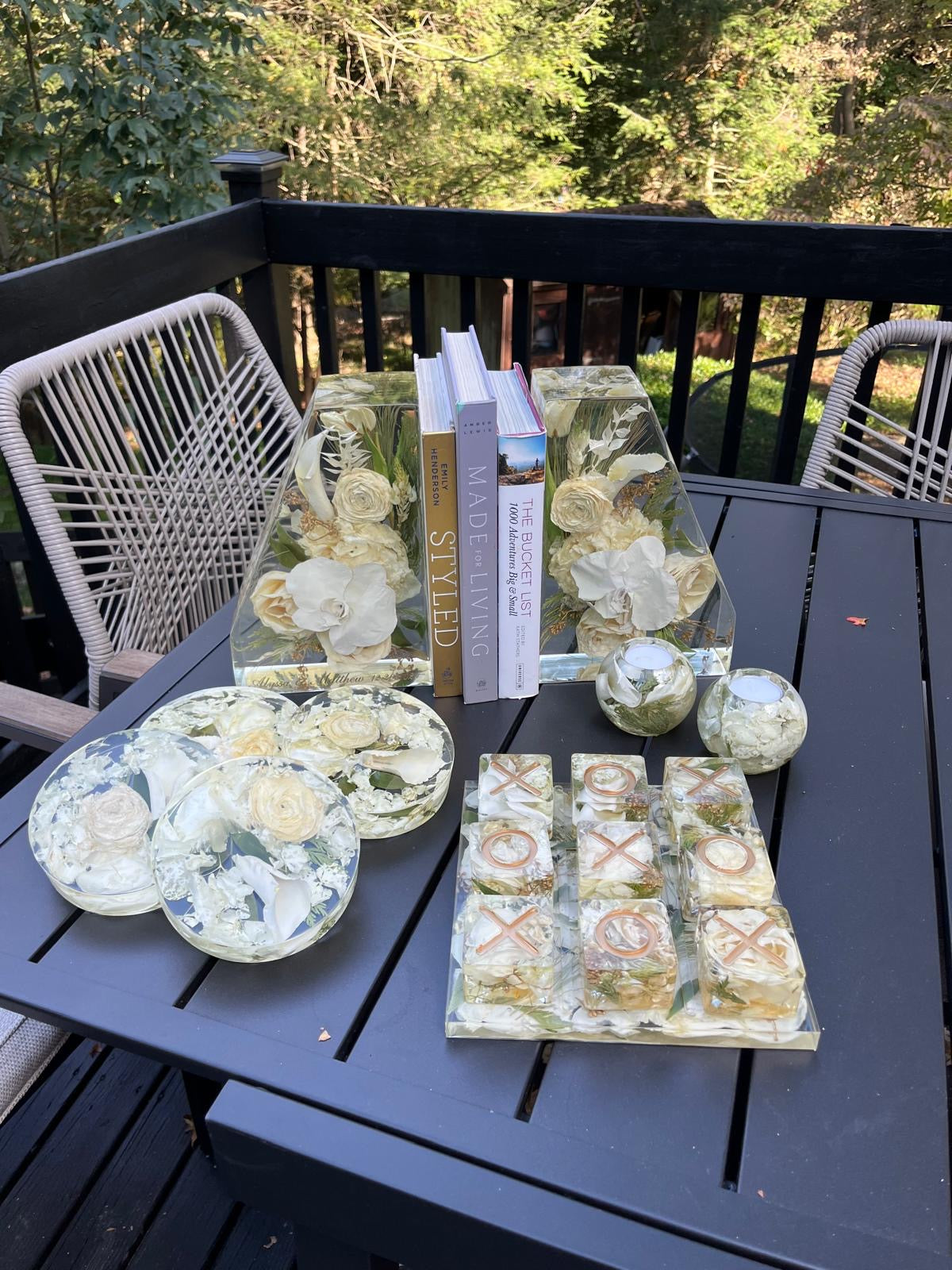 Set of Resin Floral Preservation Coasters protecting a table surface with custom wedding flowers embedded.