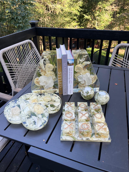 Set of Resin Floral Preservation Coasters protecting a table surface with custom wedding flowers embedded.