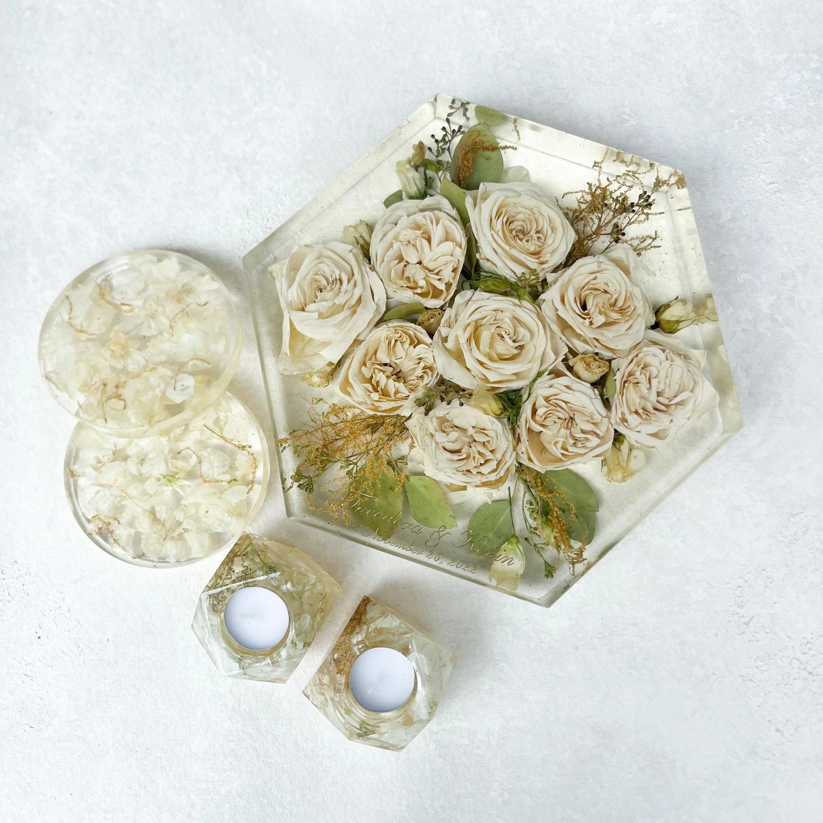 Set of Resin Floral Preservation Coasters protecting a table surface with custom wedding flowers embedded.