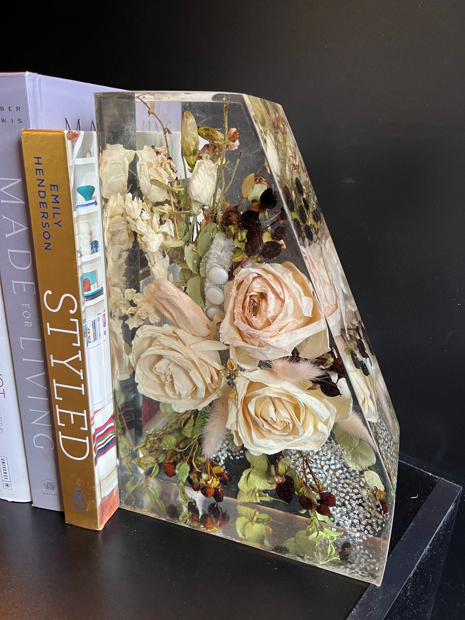 Resin Floral Preservation Straight Edge Bookends organizing a bookshelf with preserved wedding flowers inside.