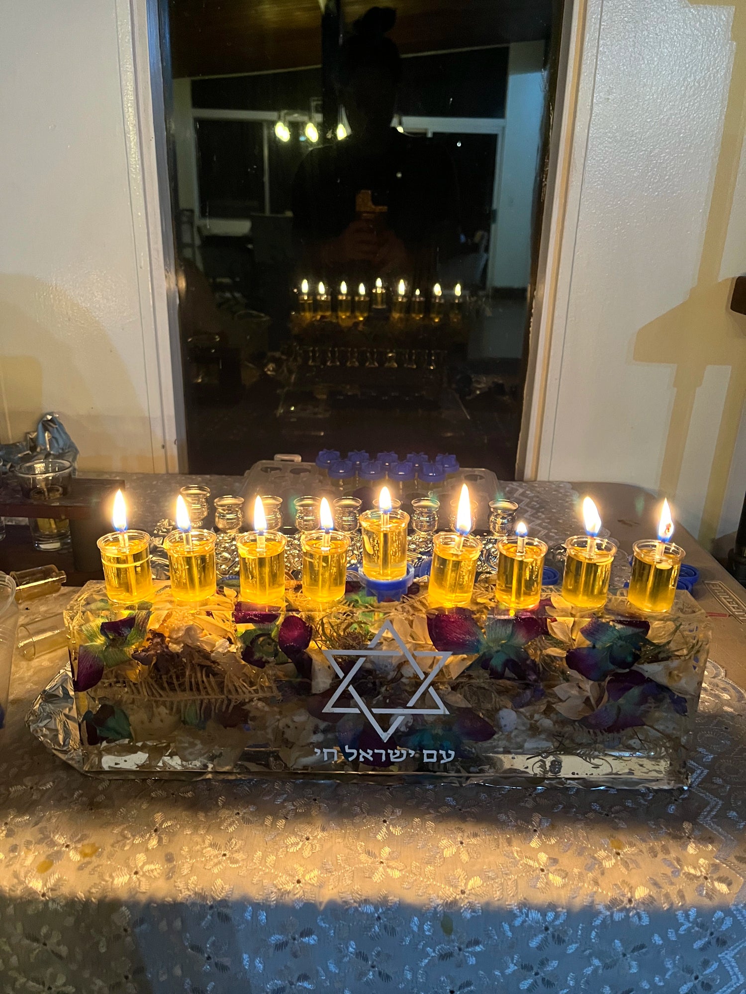 Custom Resin Floral Preservation Menorah handcrafted with colorful wedding bouquet petals for a Jewish wedding keepsake.