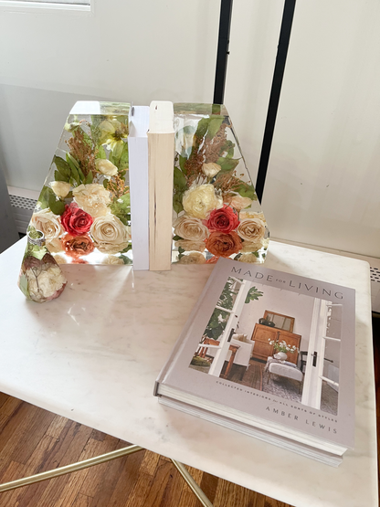 Resin Floral Preservation Straight Edge Bookends organizing a bookshelf with preserved wedding flowers inside.