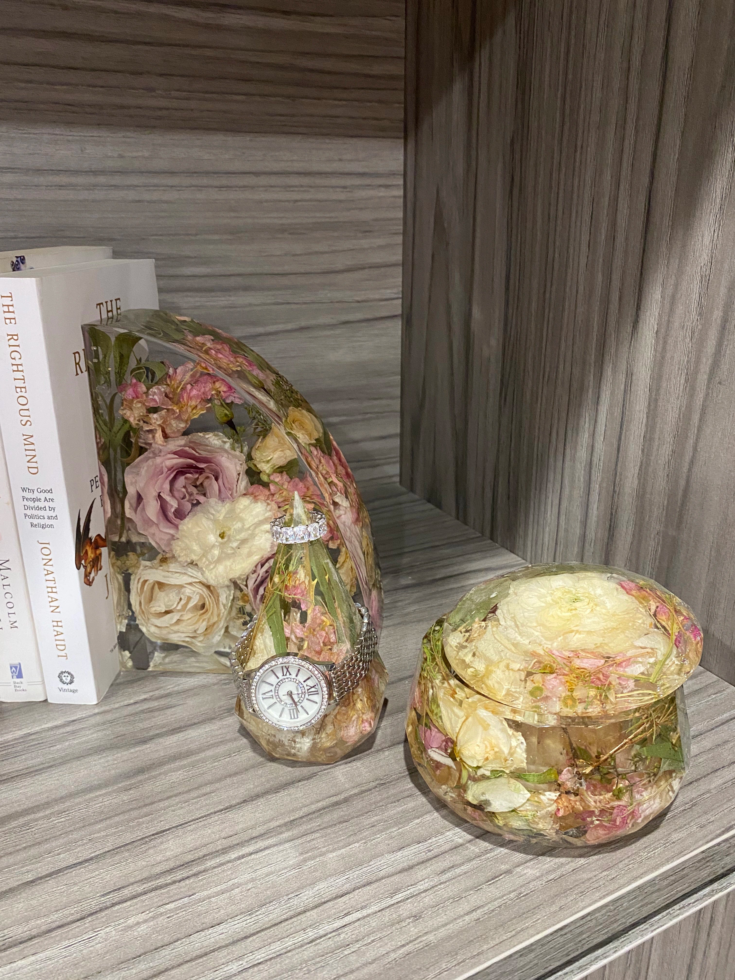 Resin Floral Preservation Jewelry Box storing wedding rings and mementos among preserved bouquet petals.