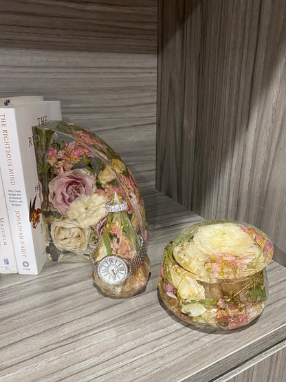 Resin Floral Preservation Jewelry Box storing wedding rings and mementos among preserved bouquet petals.