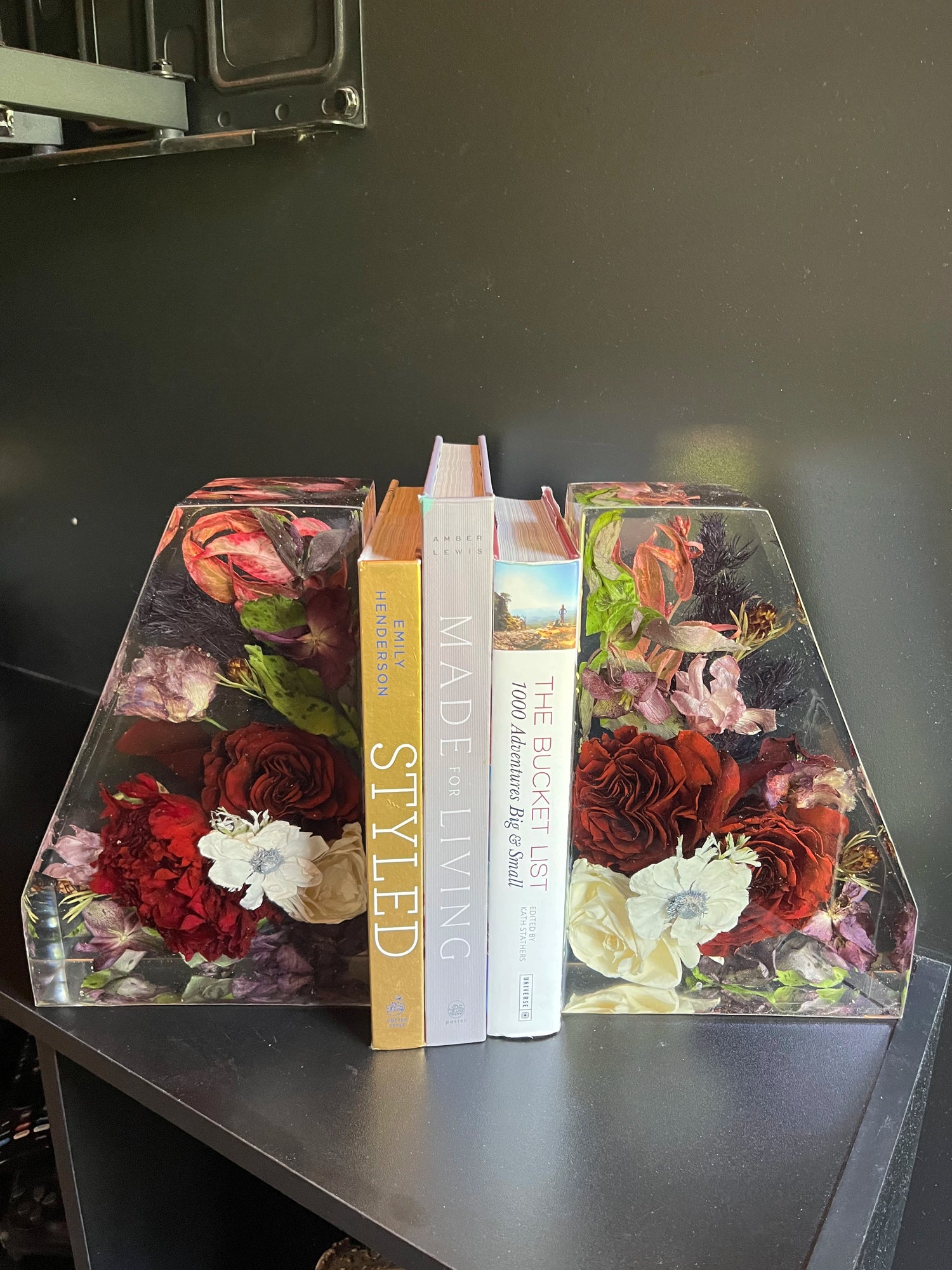 Resin Floral Preservation Straight Edge Bookends organizing a bookshelf with preserved wedding flowers inside.
