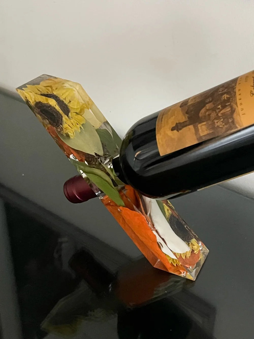 Resin Floral Preservation Wine Stand holding a bottle and glasses, featuring real preserved wedding petals.