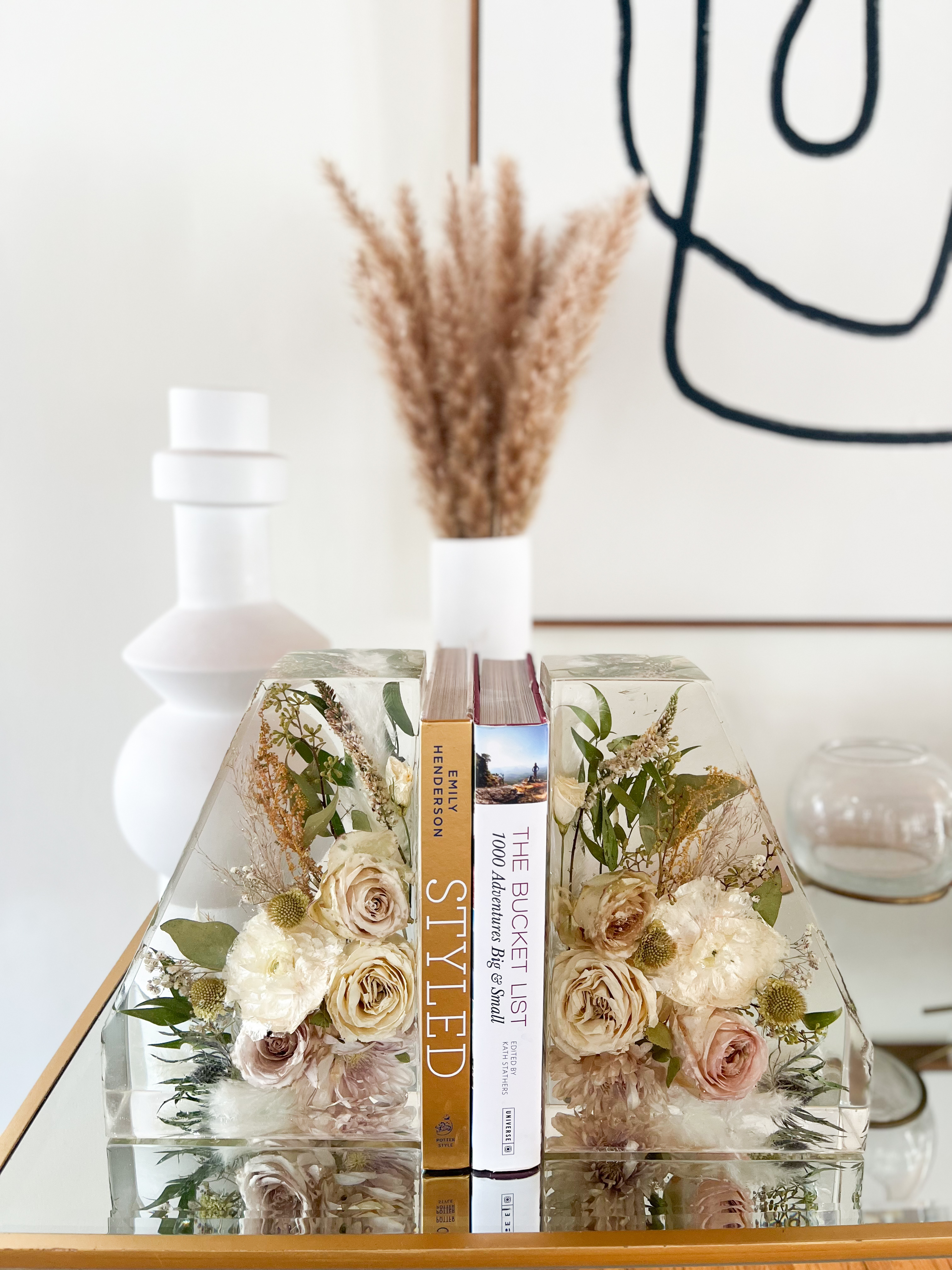 Resin Floral Preservation Straight Edge Bookends organizing a bookshelf with preserved wedding flowers inside.