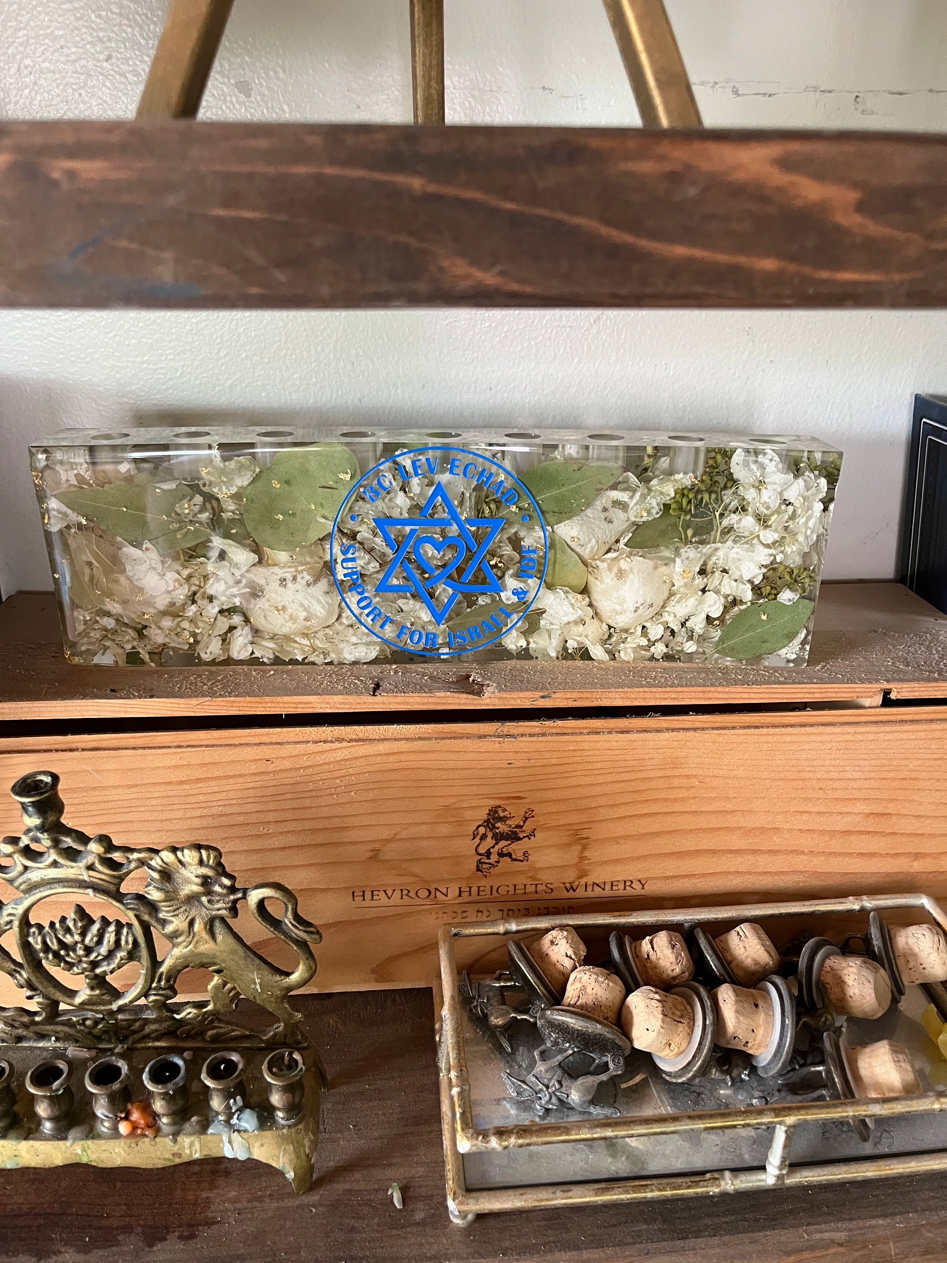 Custom Resin Floral Preservation Menorah handcrafted with colorful wedding bouquet petals for a Jewish wedding keepsake.