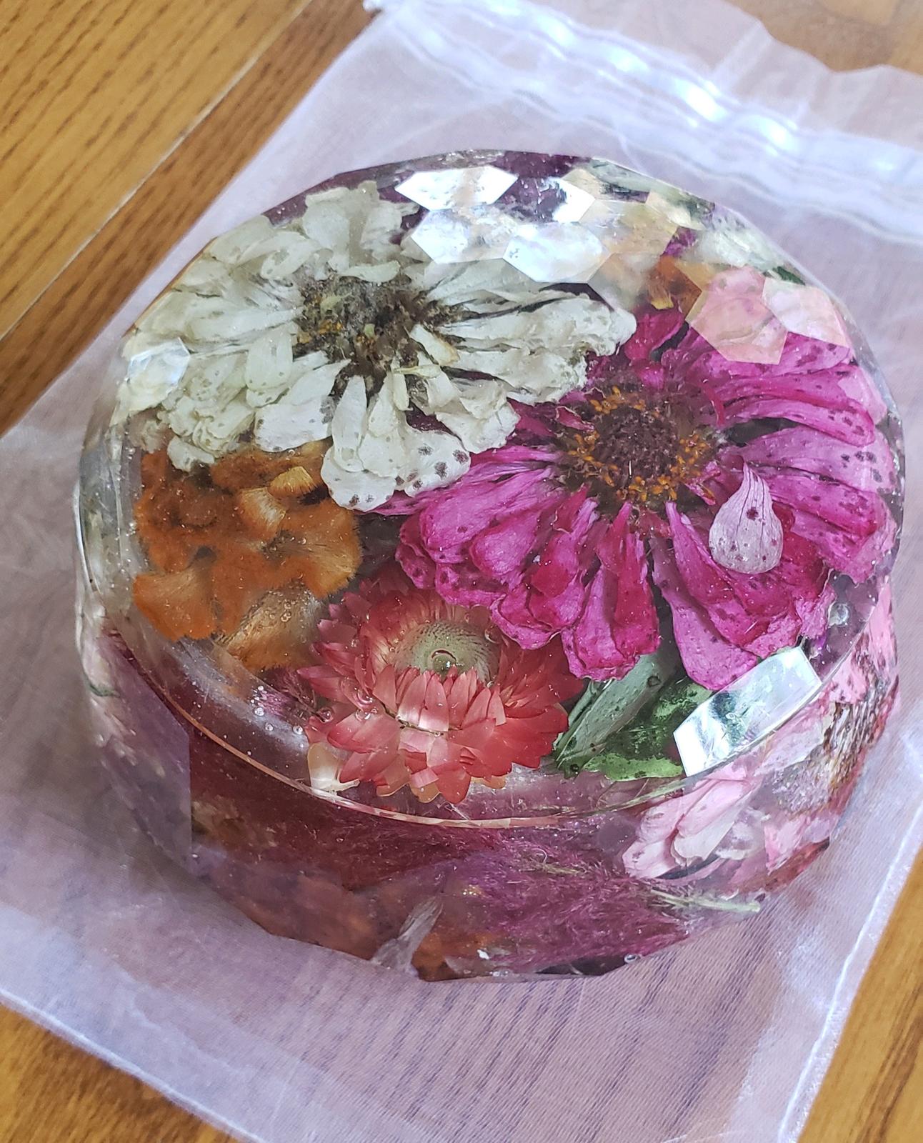 Resin Floral Preservation Jewelry Box storing wedding rings and mementos among preserved bouquet petals.
