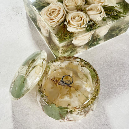 Resin Floral Preservation Jewelry Box storing wedding rings and mementos among preserved bouquet petals.