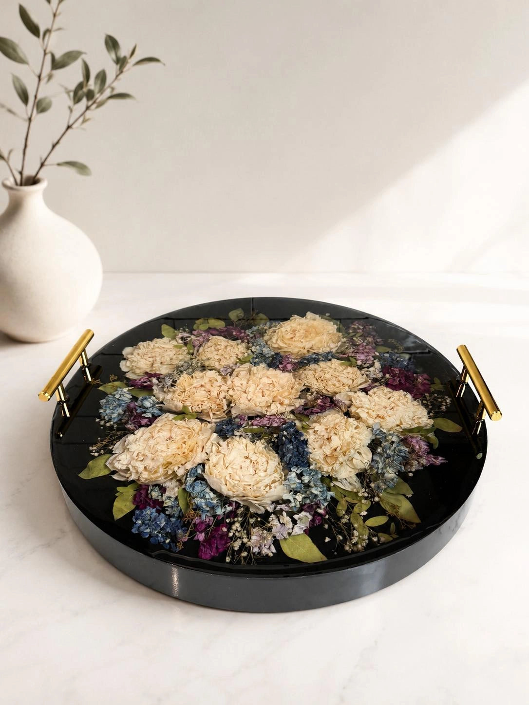 Custom round resin floral preservation tray displaying perfectly dried wedding bouquet flowers.