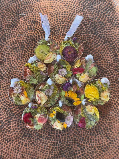 Resin Floral Preservation Ornament hanging with delicate preserved wedding bouquet petals inside.