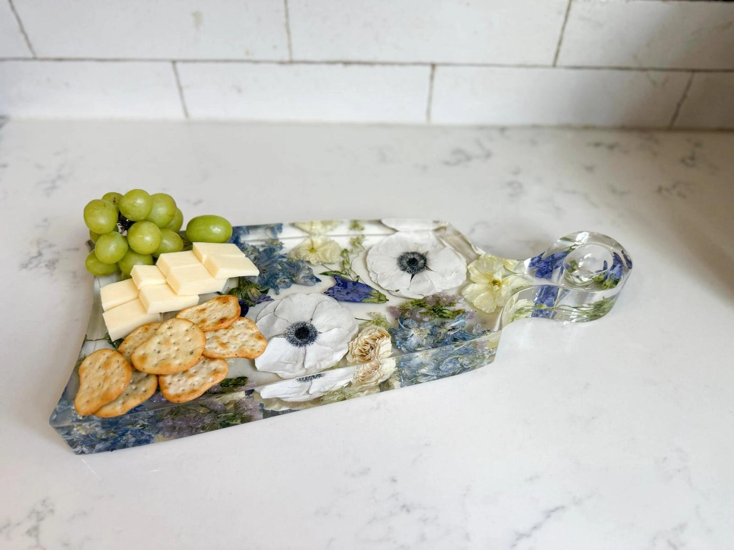 Resin Floral Preservation Charcuterie Board displaying wedding flowers in a functional serving tray.