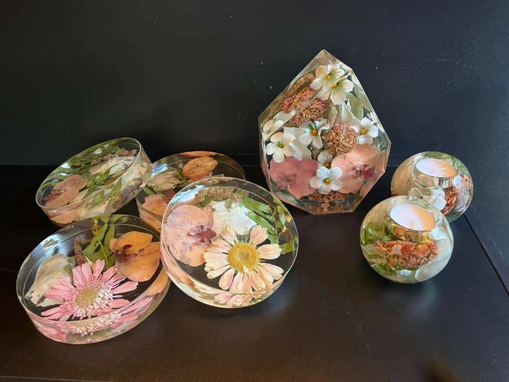 Set of Resin Floral Preservation Coasters protecting a table surface with custom wedding flowers embedded.