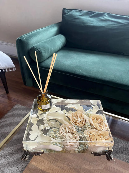 Resin Floral Preservation Vanity Tray with brass claw feet holding bridal jewelry alongside preserved wedding flowers.