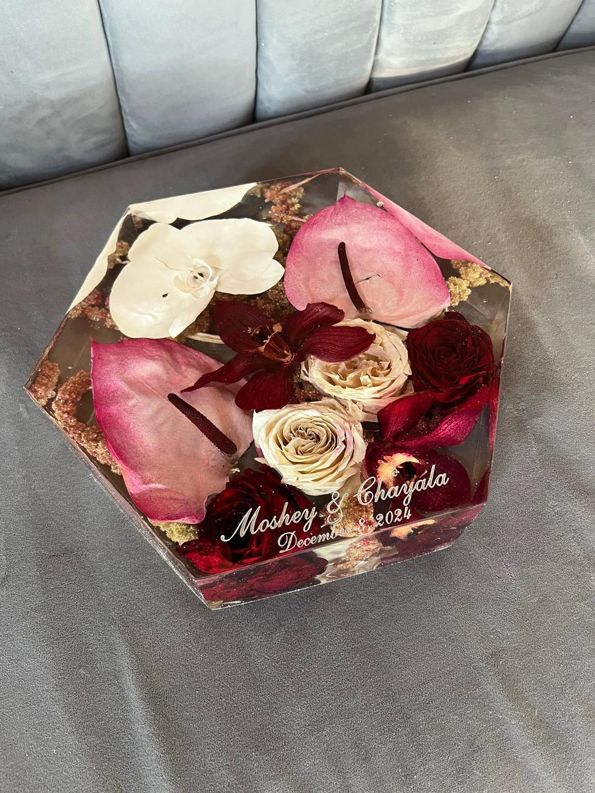 Geometric Hexagon Resin Floral Preservation Block displaying a vibrant custom wedding bouquet from all angles.