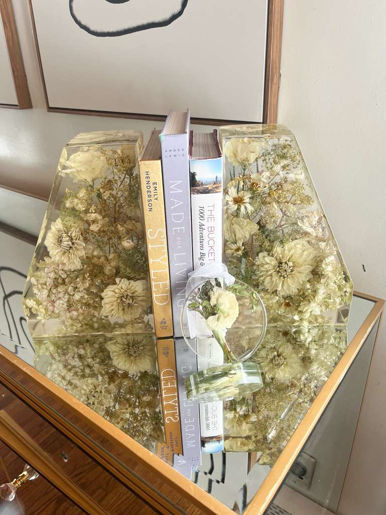Resin Floral Preservation Straight Edge Bookends organizing a bookshelf with preserved wedding flowers inside.