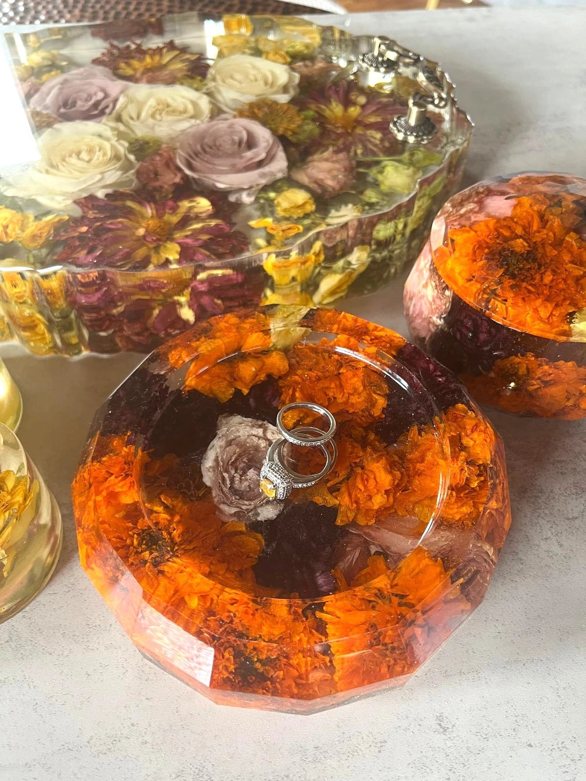 Resin Floral Preservation Trinket Dish holding small jewelry items with custom wedding bouquet fragments.